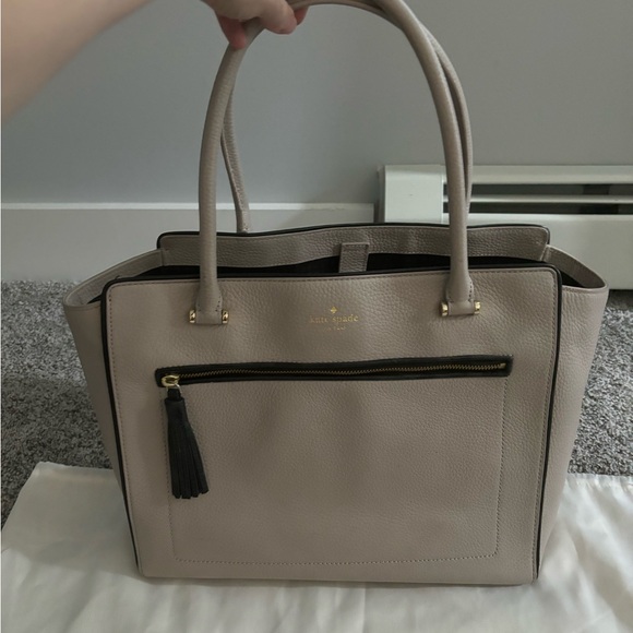 Kate Spade Handbag 👜 Tan exterior, black tassel accent, gold colored hardware. - Picture 1 of 5